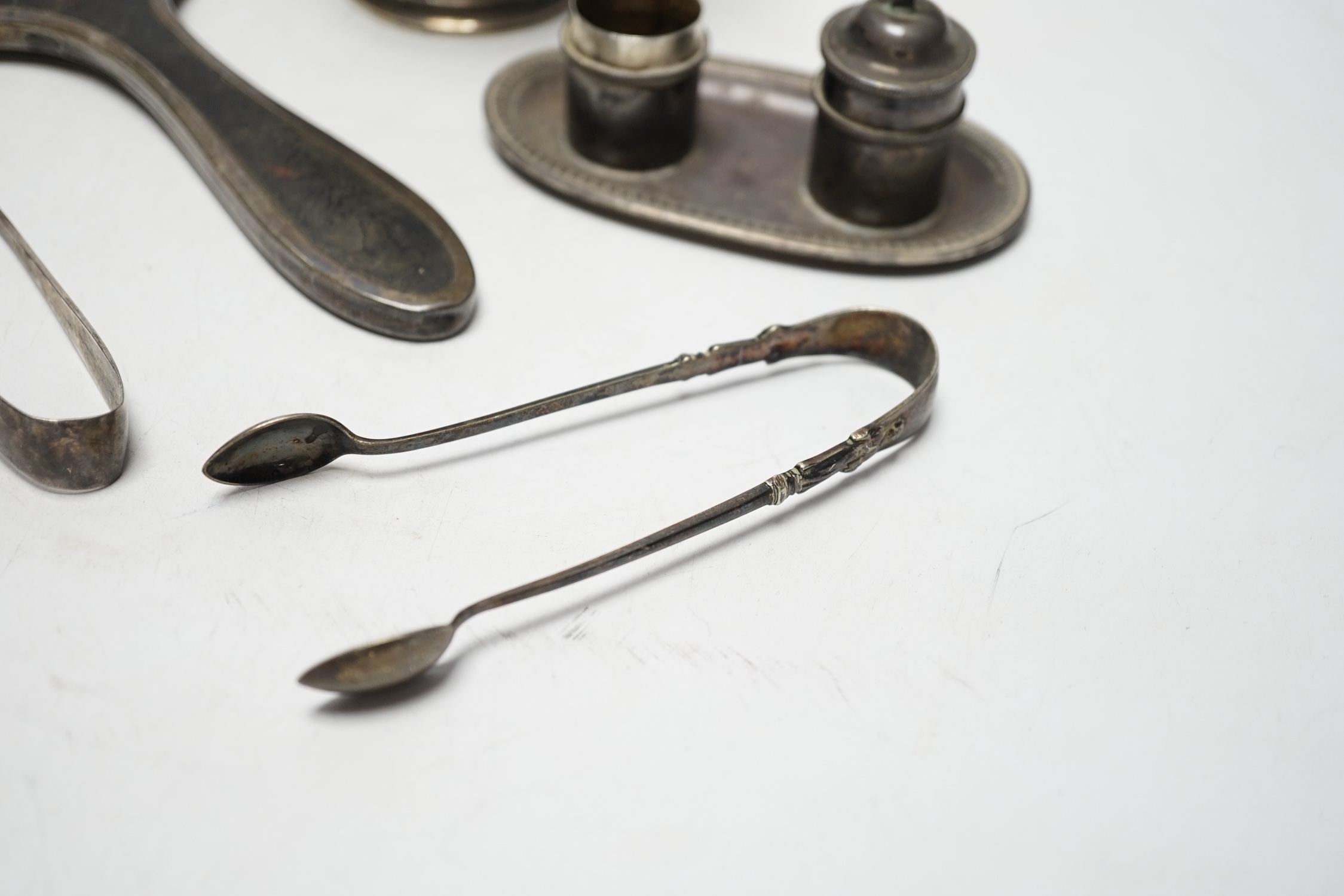 A French white metal small pedestal vase, 10.8cm, a silver and tortoiseshell mounted hand mirror and three other items including a pair of silver sugar tongs.
